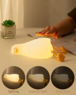 ⁦HAPPYBAG LED Lying Flat Duck Night Light. 3 Level Dimmable Nursery Nightlight.Cute Lamps Silicone Squishy Light Up Duck.Rechargeable Bedside Touch Lamp for Breastfeeding Toddler Baby Kids Decor⁩ - الصورة ⁦2⁩